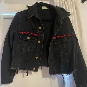 Oversized, slightly cropped denim jacket, with red ribbon trim.